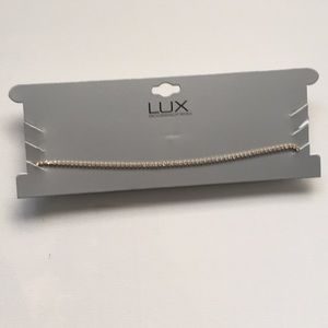 Dainty gold tone and crystal choker